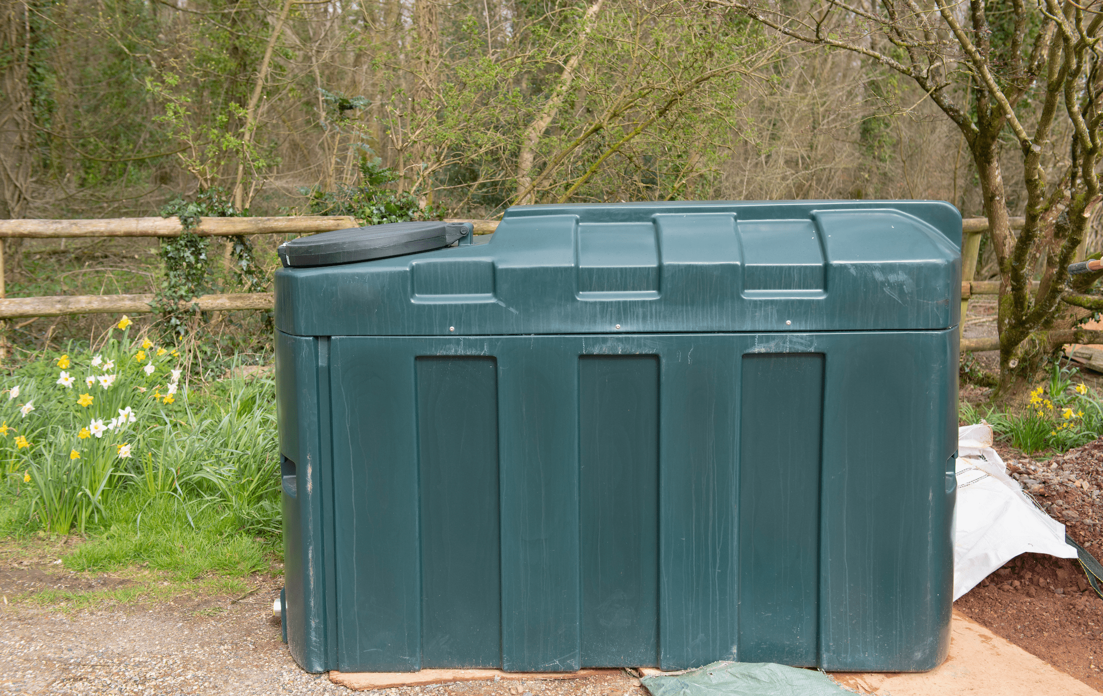 1000 Litre Bunded Oil Storage Tank Sitting on a Driveway Waiting to be Installed on a Building Site in Rural Devon, England, UK